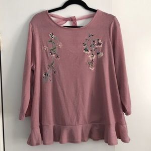 A detailed pink blouse